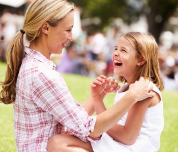 Mother,And,Daughter,Relaxing,At,Outdoor,Summer,Event